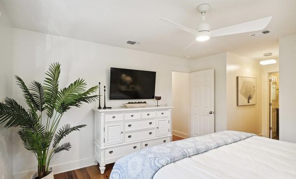 Bedroom with TV and dresser